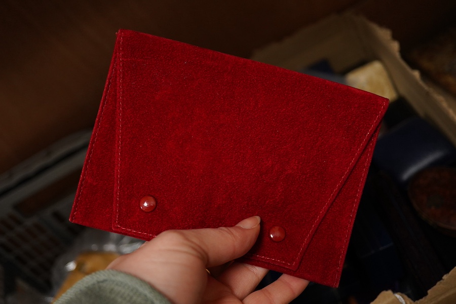 A quantity of assorted jewellery boxes including a Cartier red suede pouch. Condition - poor to fair to good.